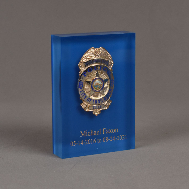 Embedded police badge with blue background and gold color filled laser engraved text.